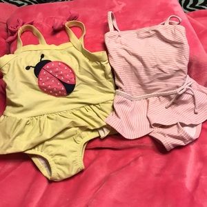 Two 2T girls swimsuits. Both in great condition!